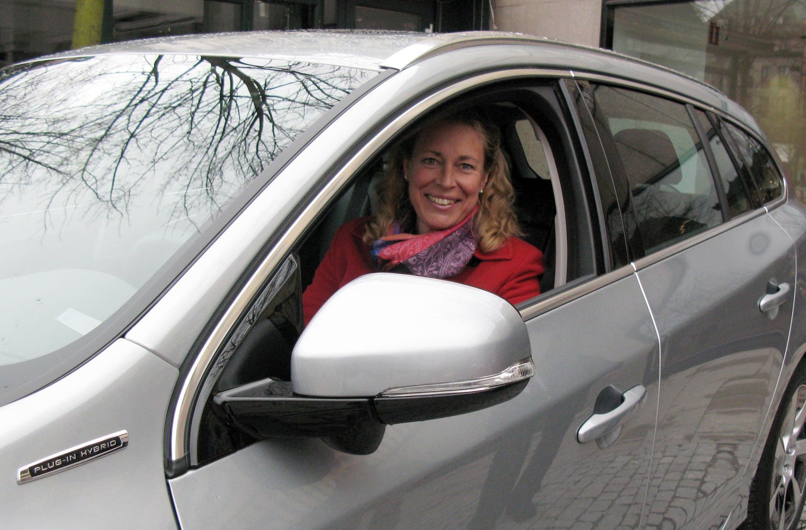 Annika Ramsköld, Head of Sustainability at Vattenfall sitting in a hybrid car