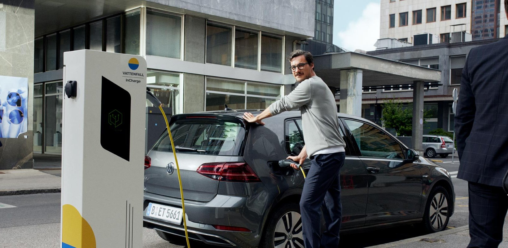 Man charging an electric car