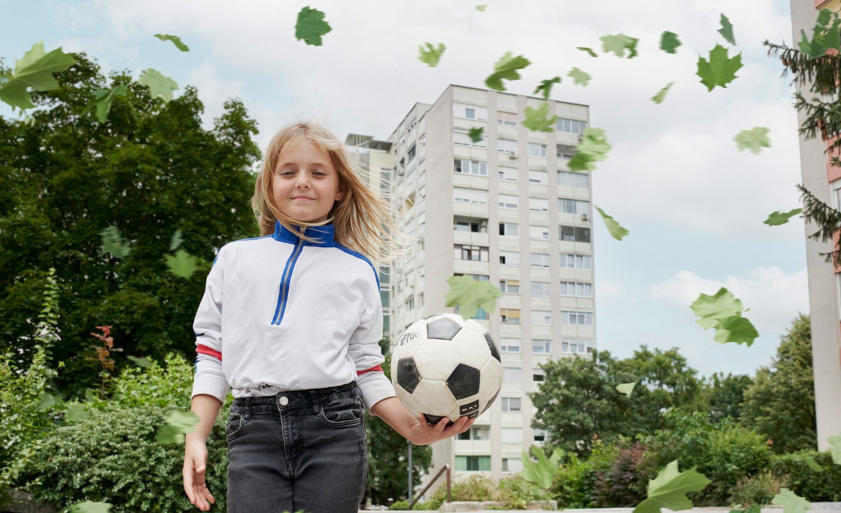 A girl holding a football