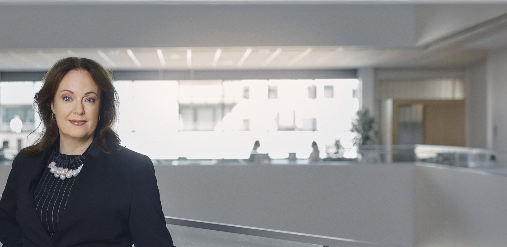 Anna Borg, Vattenfall's President and CEO, stands in a modern office interior.