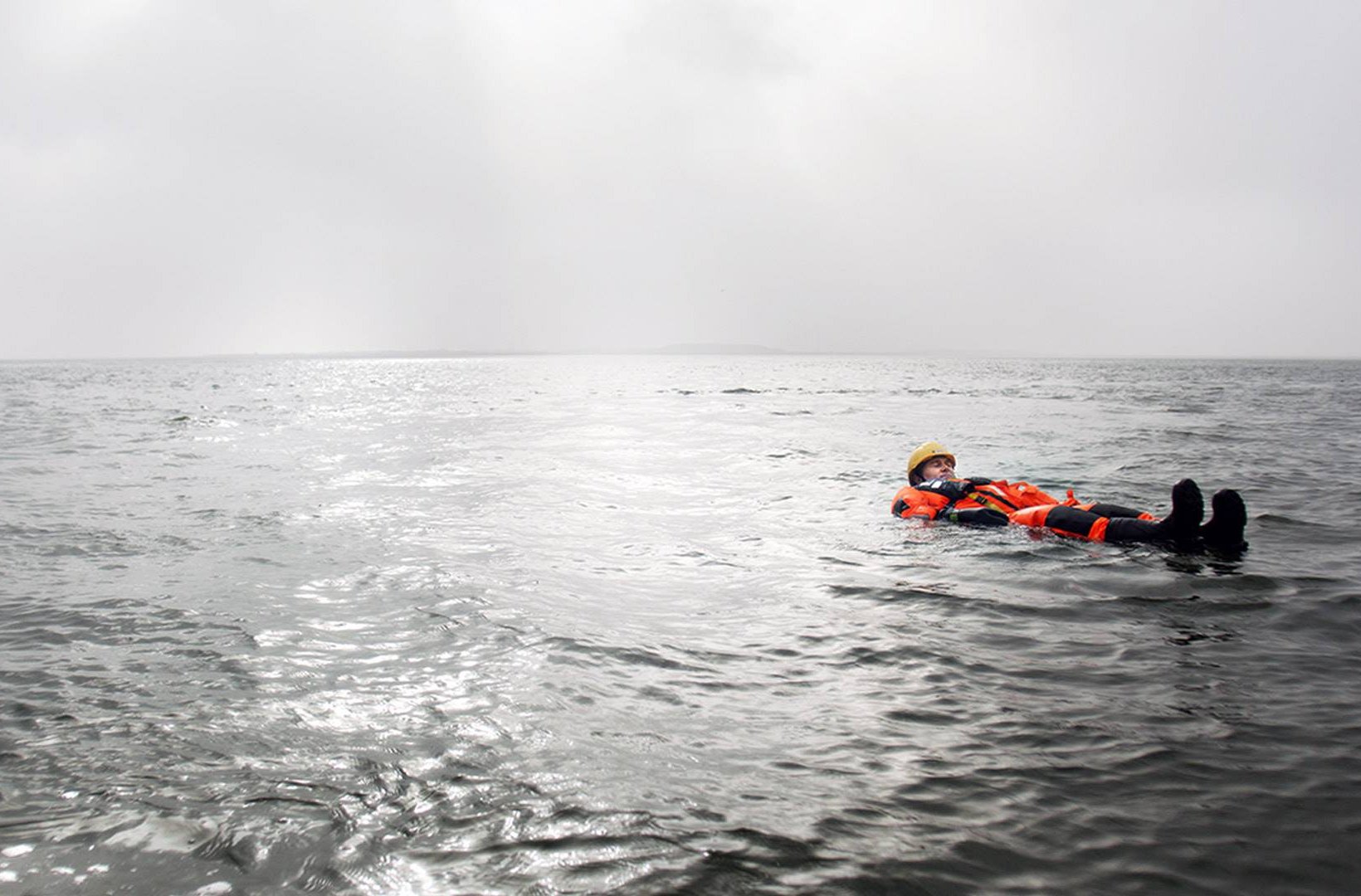 Sea rescue course participant floating at sea