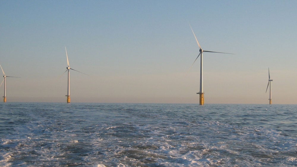 Four offshore wind turbines.