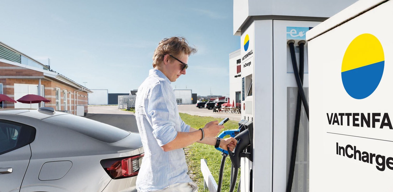 A man charging his electric car