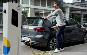 Man charging electric car