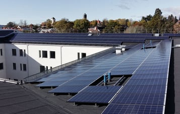 Solar panels on the roof of an apartment building