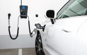 Electric car connected to a charging station