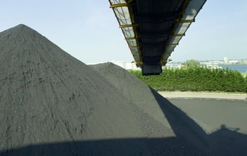 A coal mountain with a conveyor belt above it
