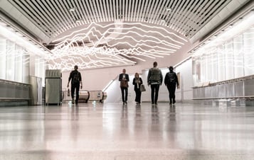 People in a walkway in the Stockholm metro system