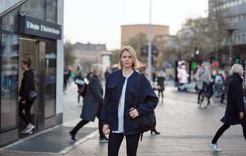 Young woman on a busy street in Stockholm