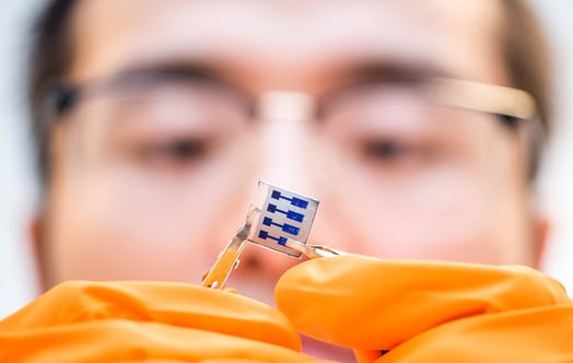 Man holding small solar cell. Photo: Olov Planthaber