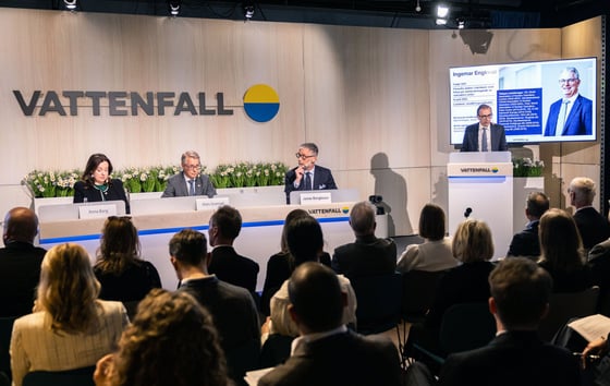 Speakers at a podium and an audience in the foreground at Vattenfall’s Annual General Meeting 2026.