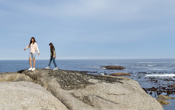 Kids on rocks by the sea