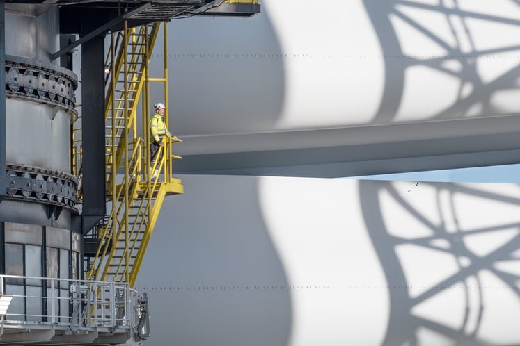 A worker looking at wind turbine components at Hollandse Kust Zuid.