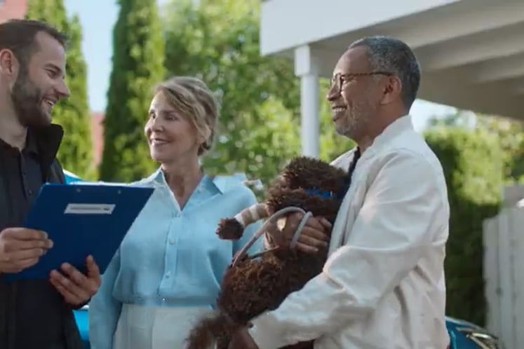 Three people and a dog