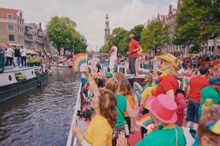 Participants on a boat at the Amsterdam Pride parade. Participants on a boat at the Amsterdam Pride parade.