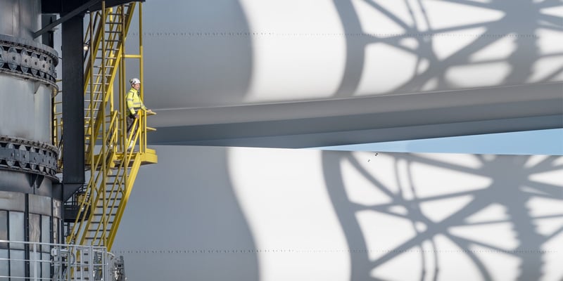 A worker looking at wind turbine components at Hollandse Kust Zuid.