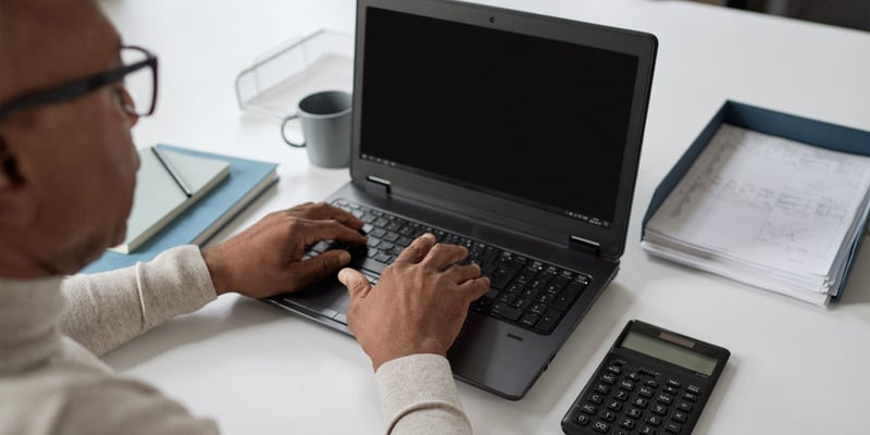 A man working on a laptop A man working on a laptop