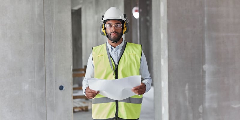 Man with protective clothing on a construction site