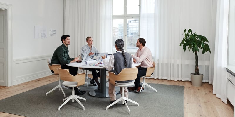 People sitting at a table in a meeting room