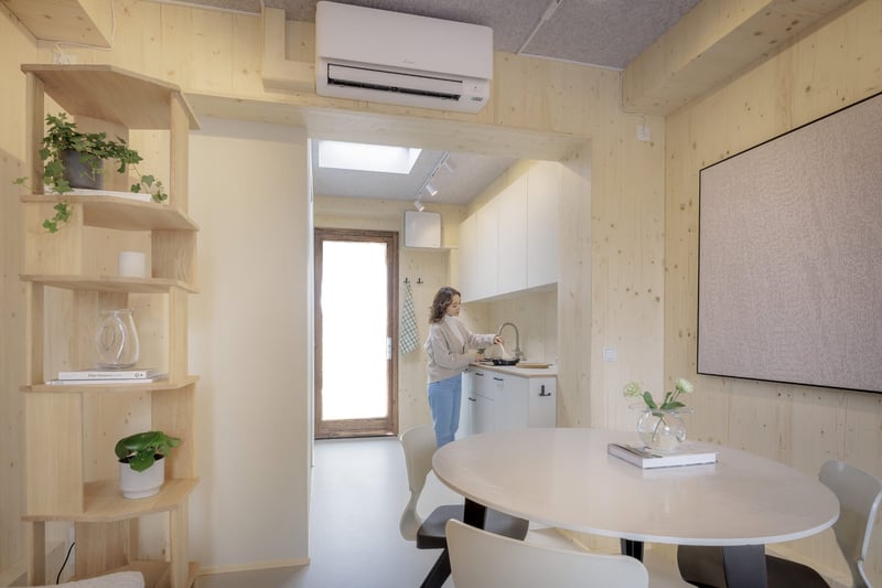 A woman cooking inside the Tiny. Photo: Jorrit Lousberg