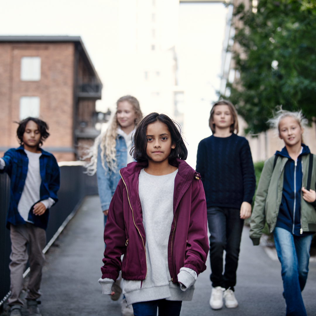 Children walking in urban neighborhood