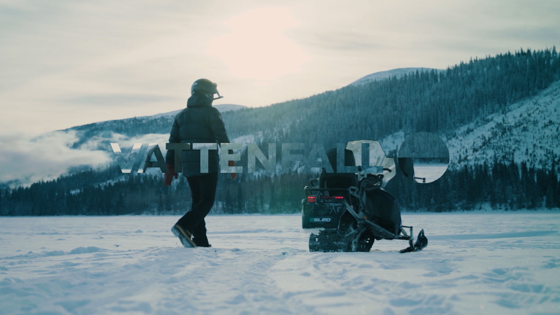 Electric snowmobile in winter landscape