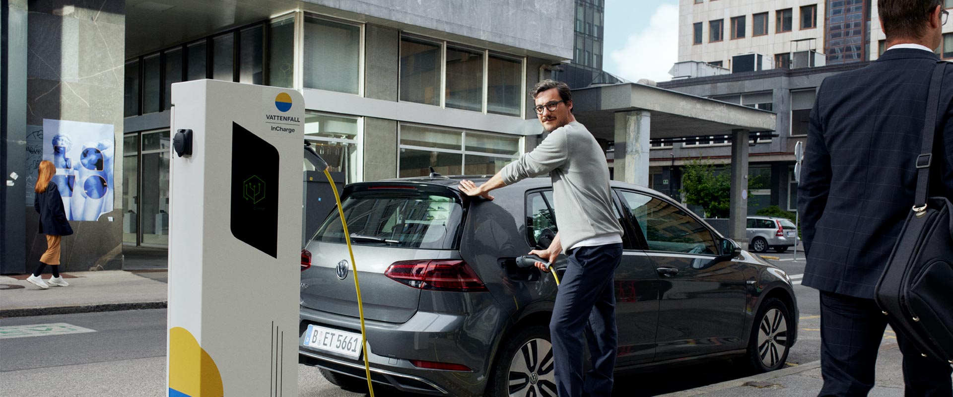 Man charging an electric car