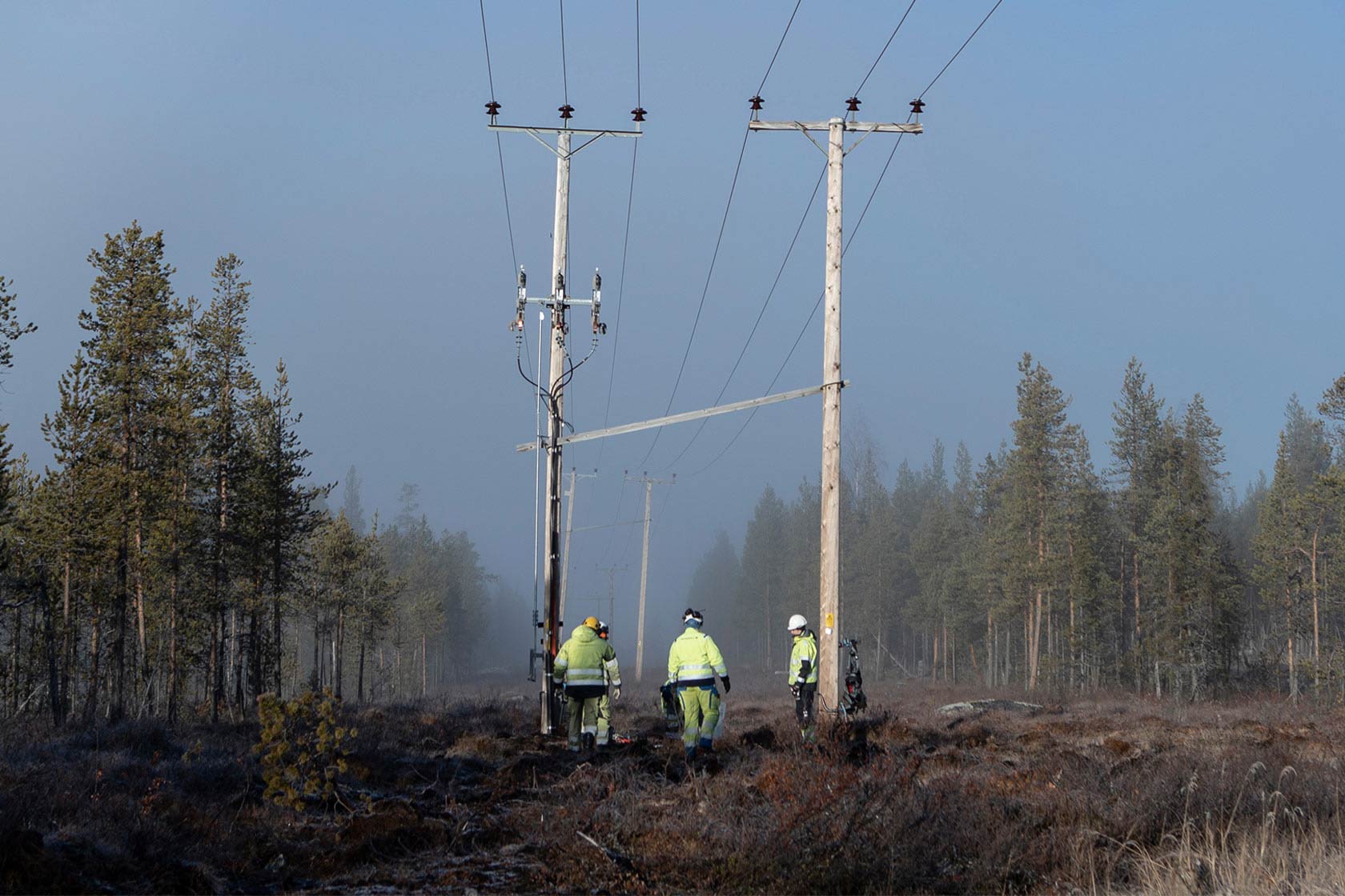 Employees inspecting power lines in northern Sweden