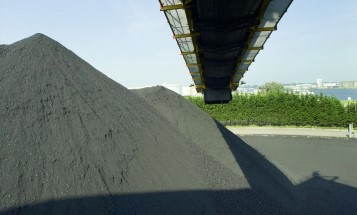 A coal mountain with a conveyor belt above it