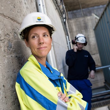 A female employee at Boden hydro power station and her male colleague in the background