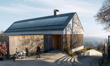 Talo, jonka katolla on aurinkopaneelit