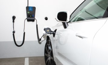 Electric car connected to a charging station