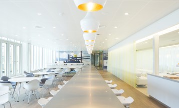 Tables and chairs in a room in Vattenfall's Amsterdam office