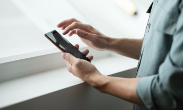 Close-up of hands holding a mobile phone