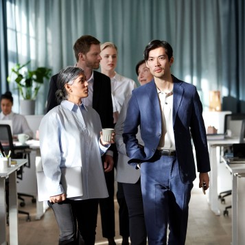 Group of people walking in an office