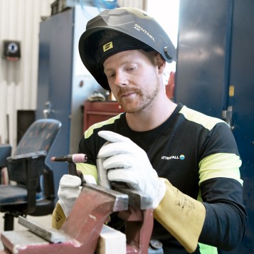 Metalworking employee with helmet