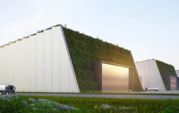 Ett förslag på design av SMR-byggnader. Byggnaderna är utformade som stora enkla volymer med sluttande gröna tak
