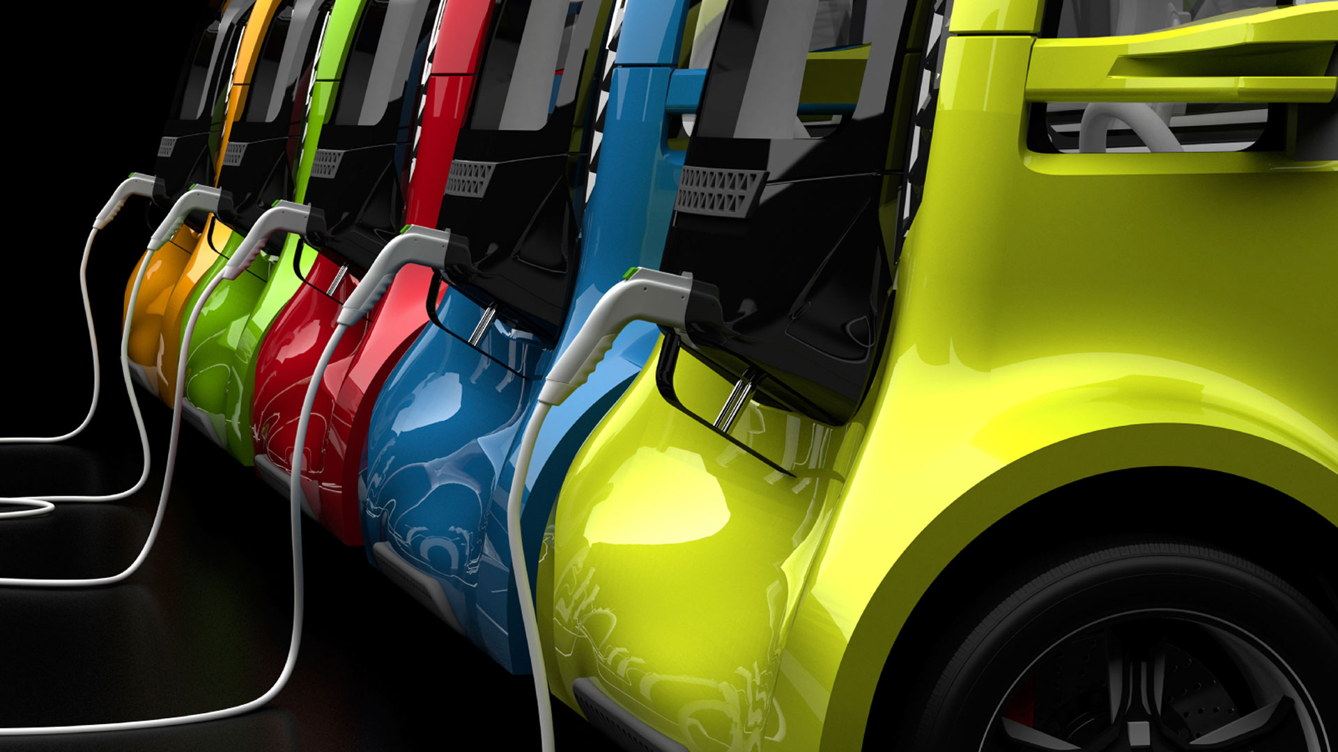 En rad färgglada elbilar på laddning