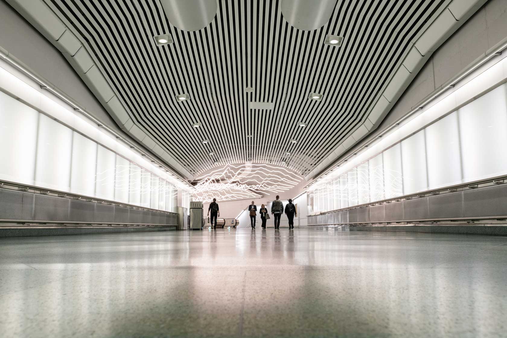 People walking in a Stockholm city tunnel