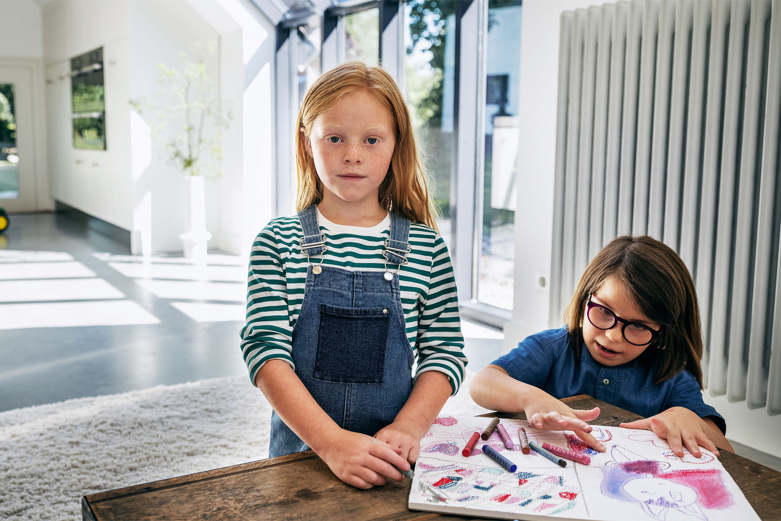 Two girls with a colouring book