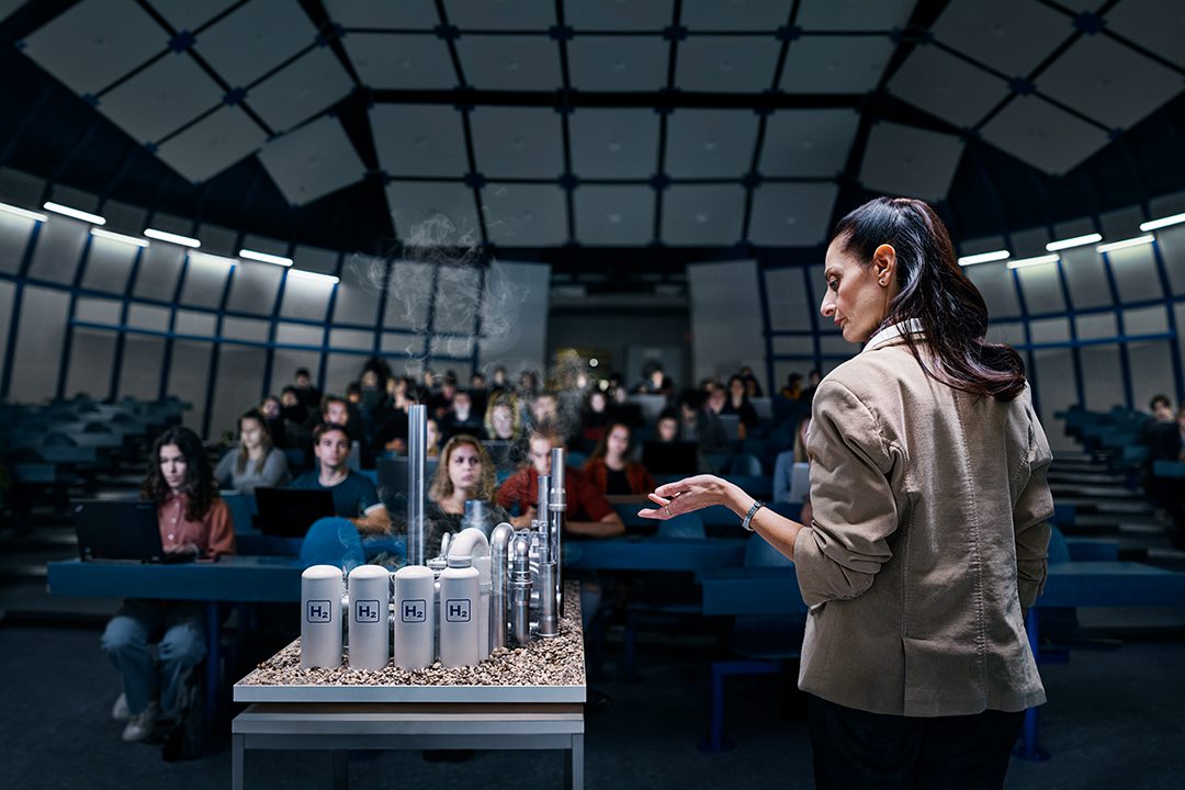  A woman demonstrating a model of a factory