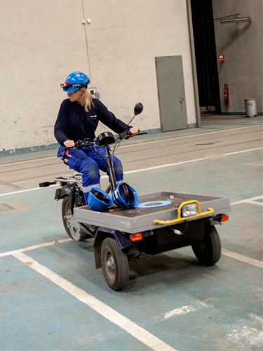 Electrician Kaisa Lithander on an electric moped