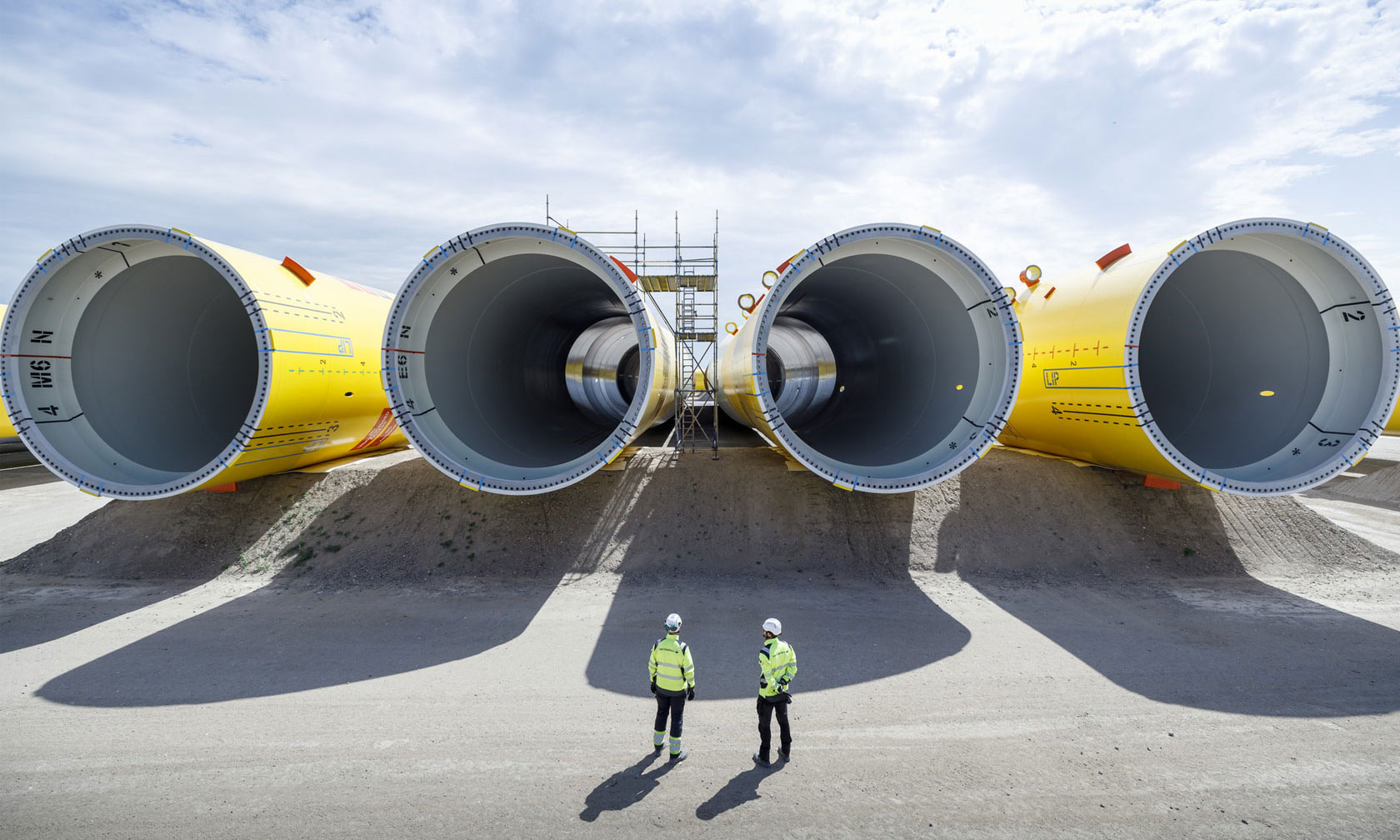 Two people in front of wind components for the wind park Hollandse Kust Zuid