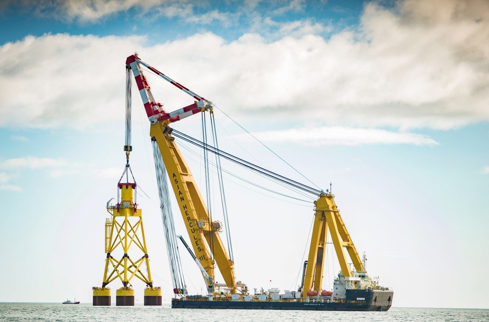 Asian Hercules III installing suction bucket jacket foundation at EOWDC 