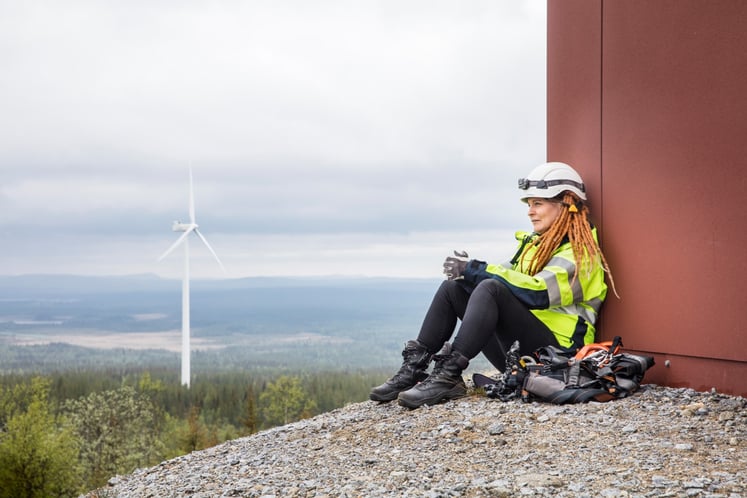 Vattenfall employee sitting at the bottom of a turbine